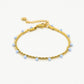 Dubbele armband lila kraal goudkleurig