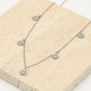 Fijne ketting met 5 smiley hangers zilverkleurig