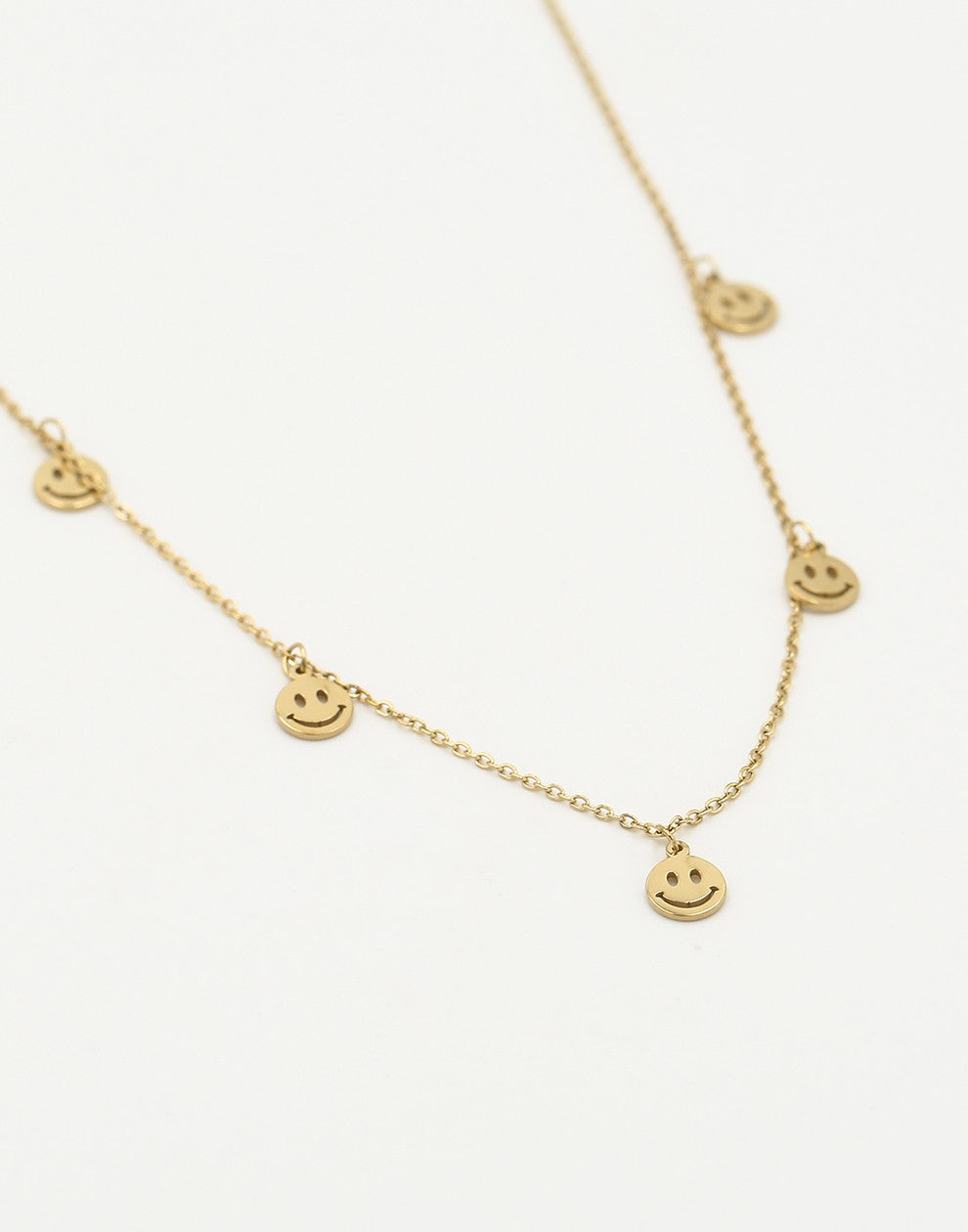 Fijne ketting met 5 smiley hangers goudkleurig