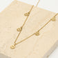 Fijne ketting met 5 smiley hangers goudkleurig
