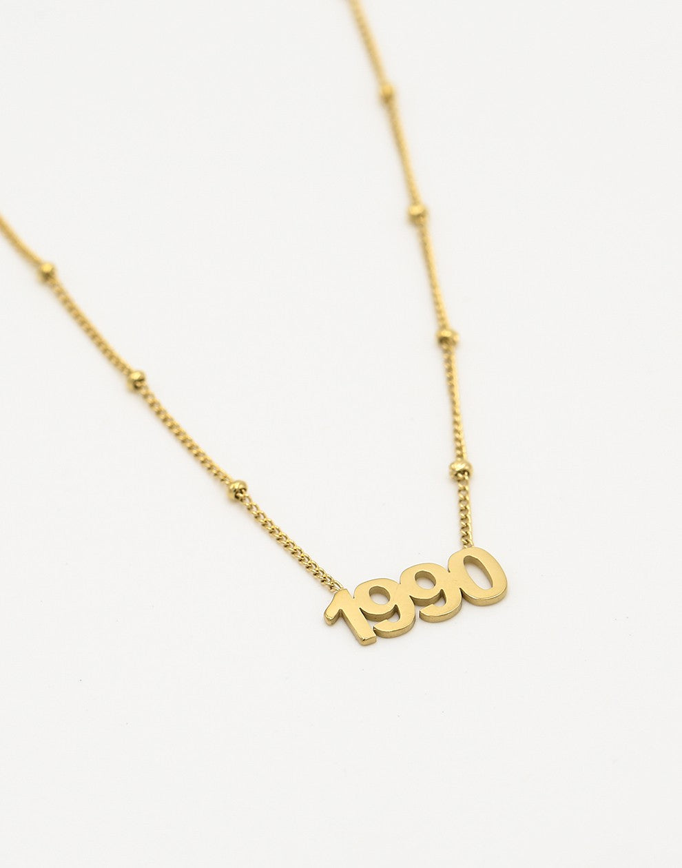 Ketting jaartal 1990 goudkleurig