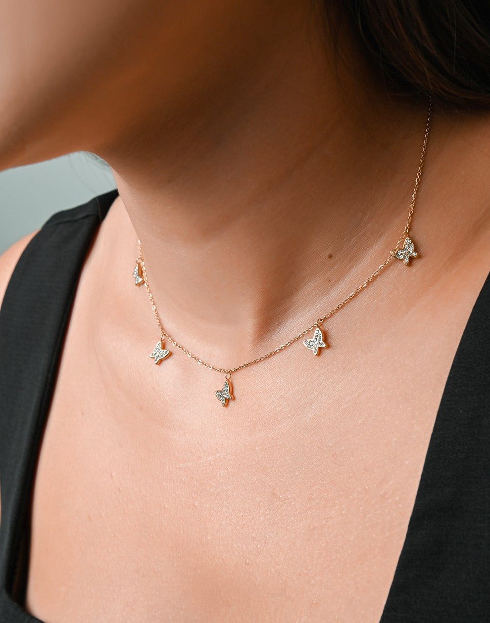 ketting vlinders steentjes goudkleurig