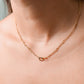ketting bolletjes met dubbele hartjes goudkleurig