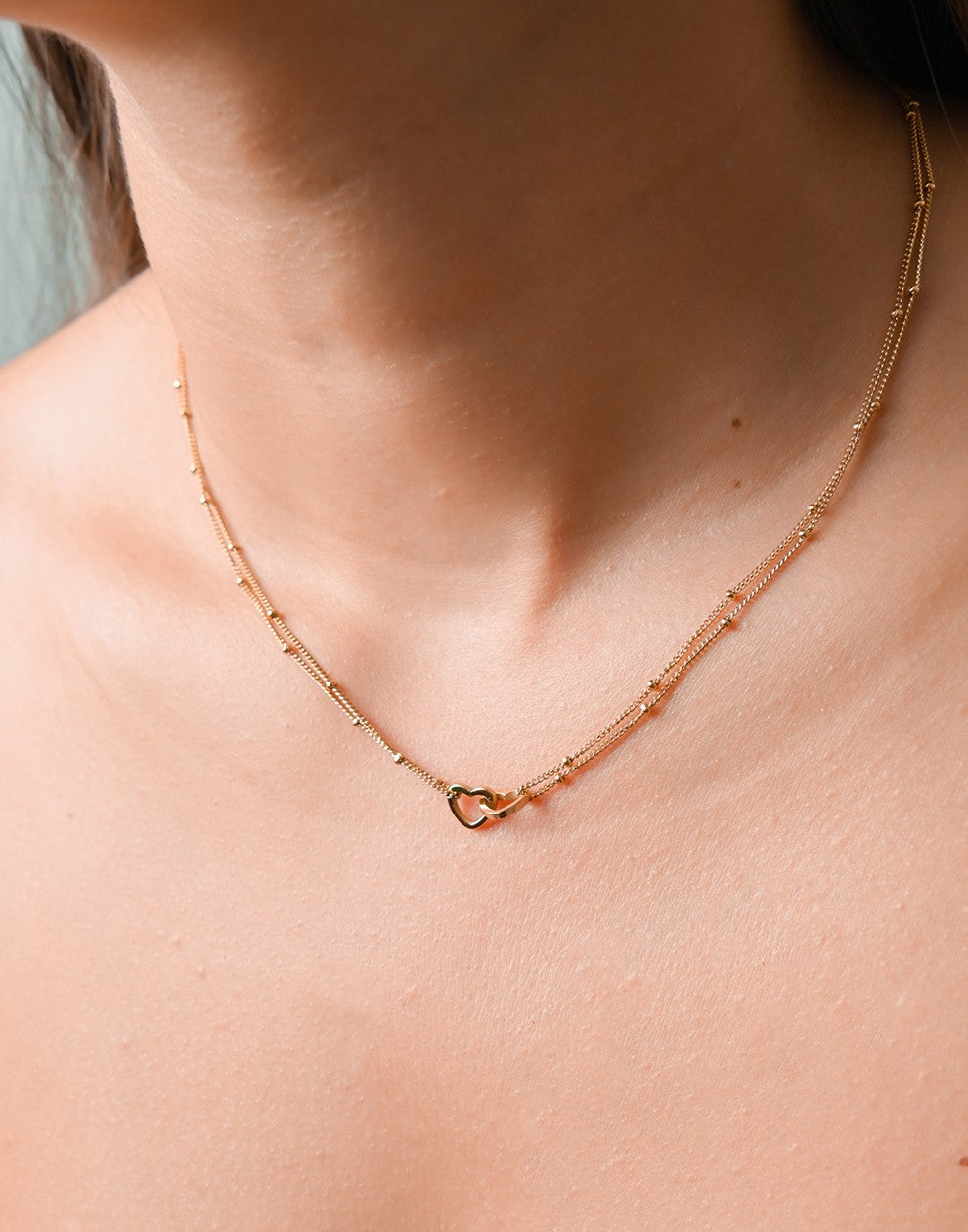 ketting bolletjes met dubbele hartjes goudkleurig