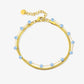 Dubbele armband goudkleurig lila