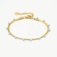 Dubbele armband goudkleurig lila
