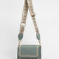 Crossbody tas met bewerkte strap groen