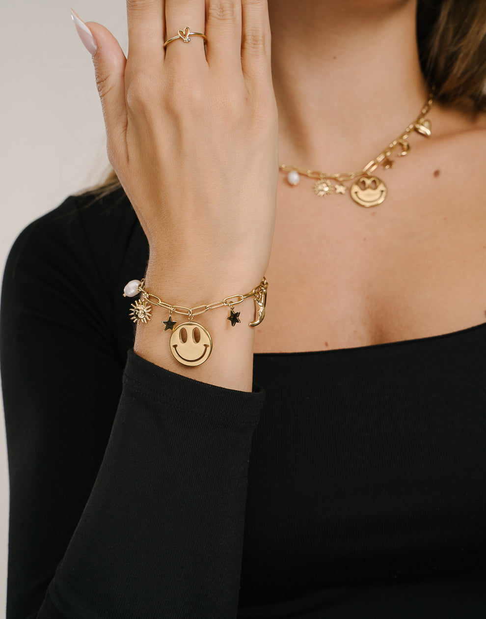 Charm-Armband mit Smiley-Sternen, goldfarben