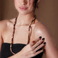 Lange kralenketting bruin