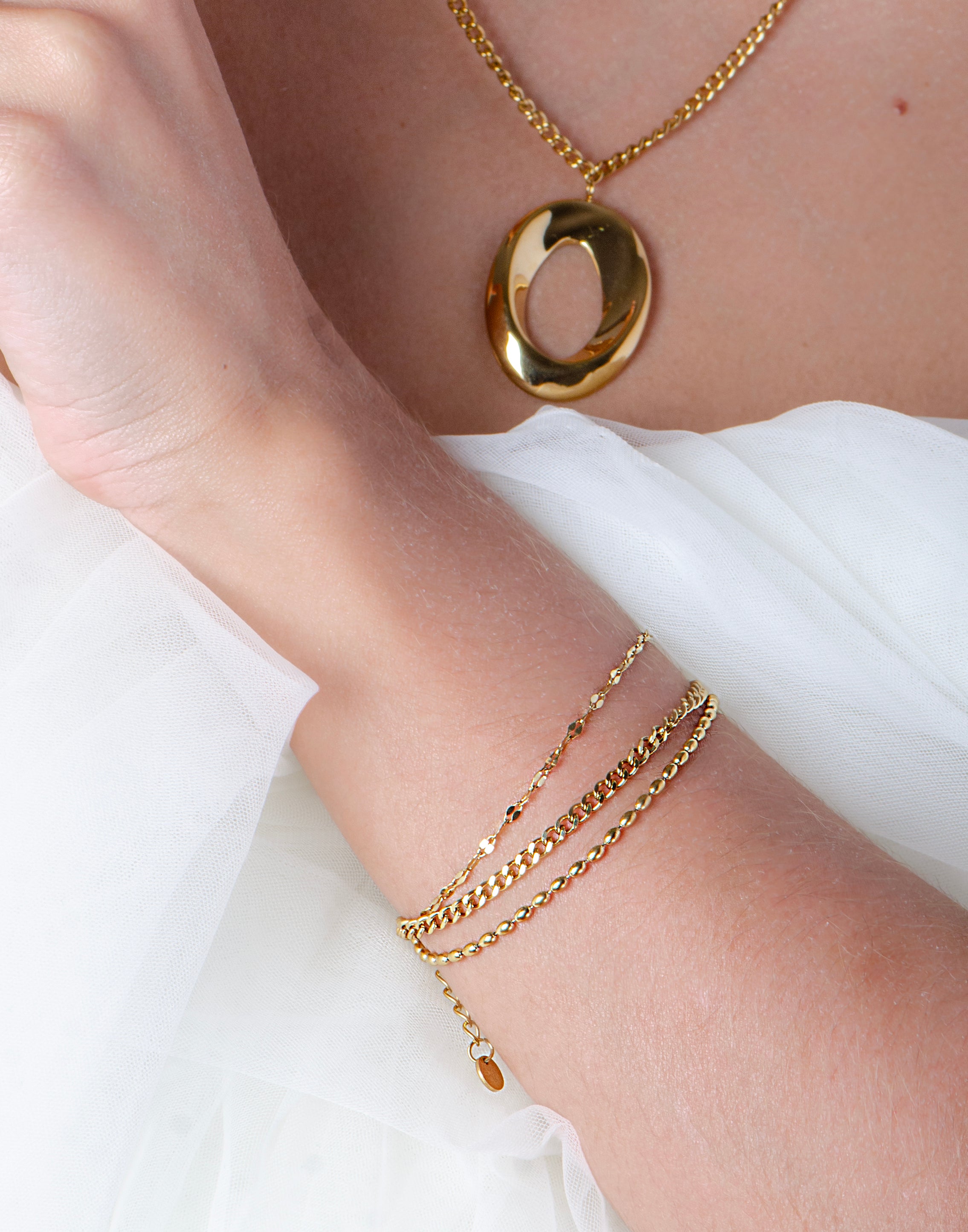 Armband triple schakels goudkleurig