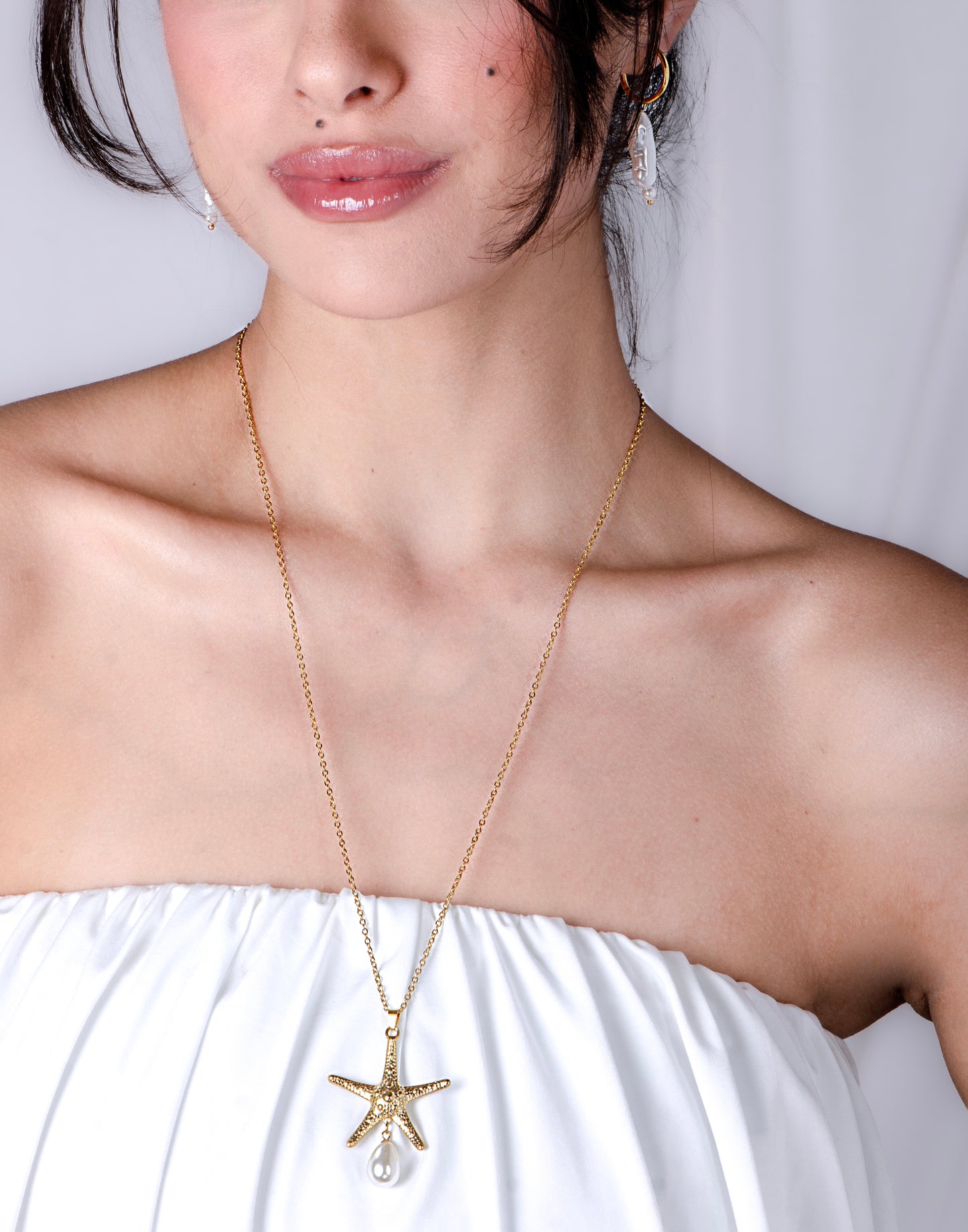 Lange ketting zeester met parel