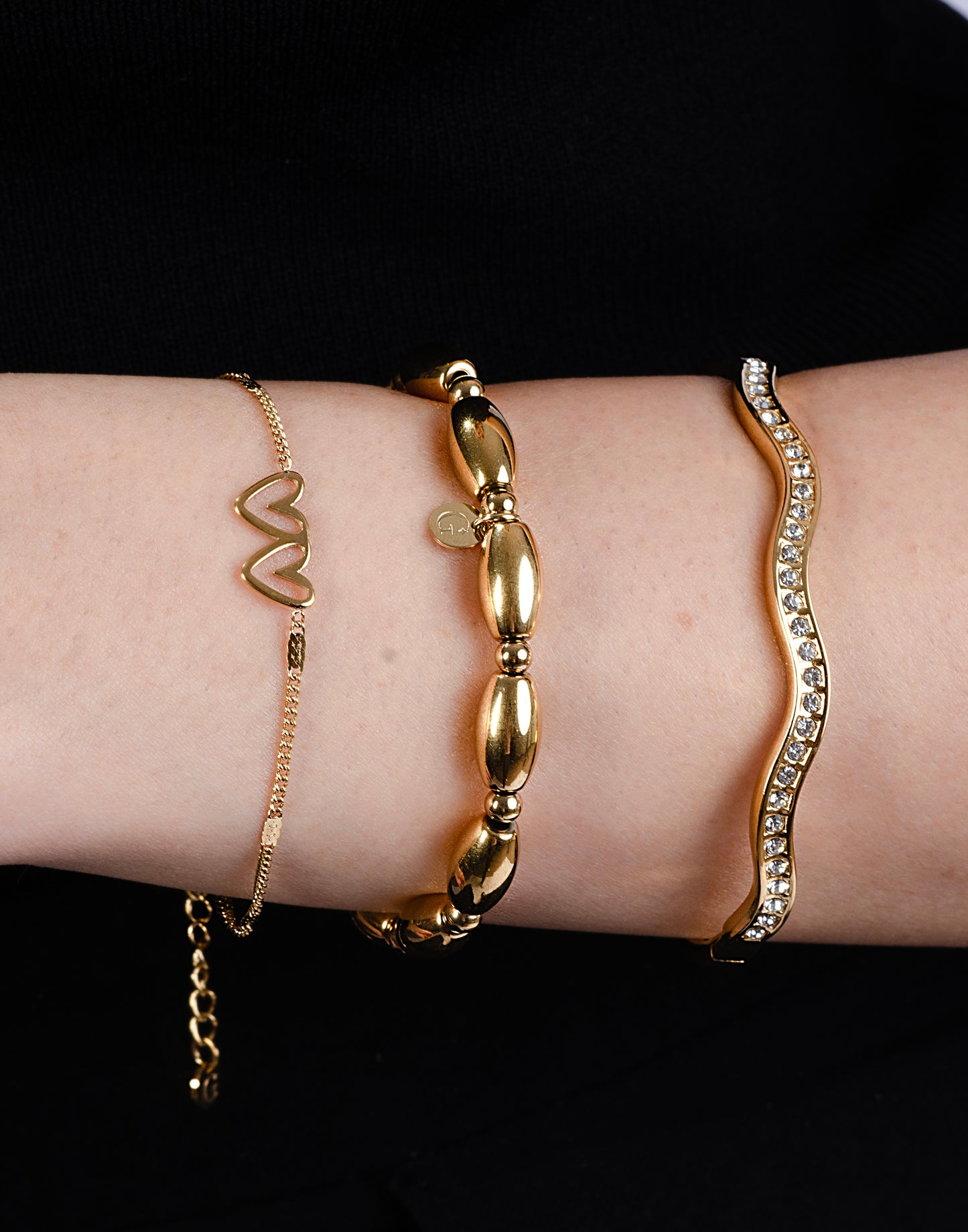 Armband dubbele hartjes met schakels goudkleurig