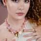 Asymmetrische kralenketting met bedels roze