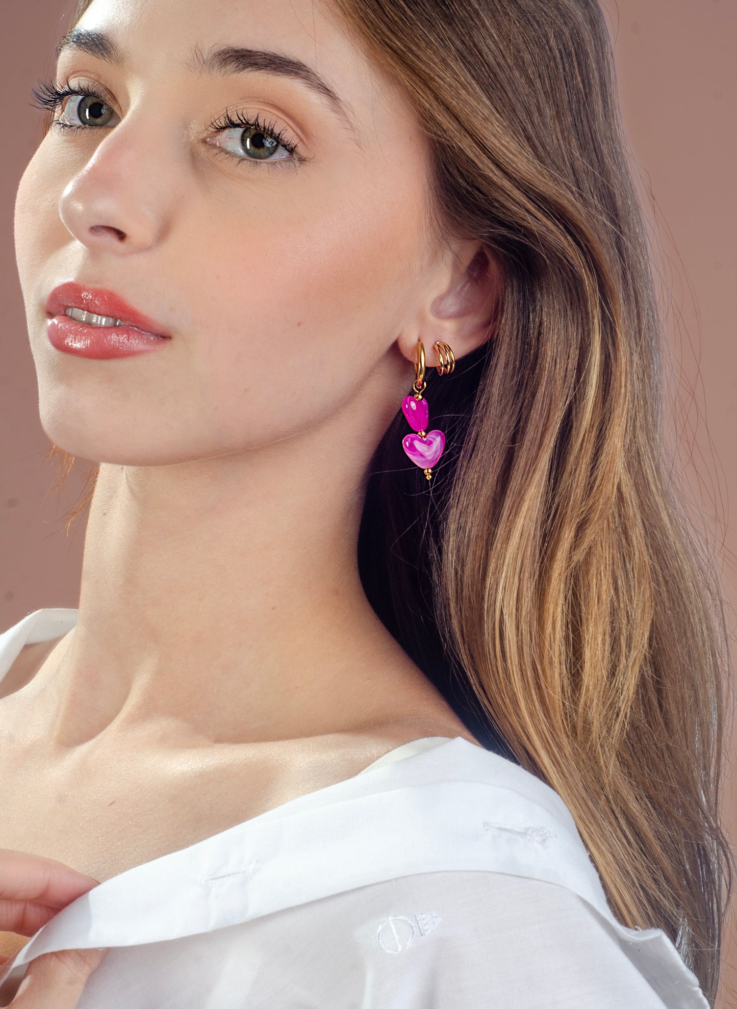 Hartjes kralenoorbellen fuchsia