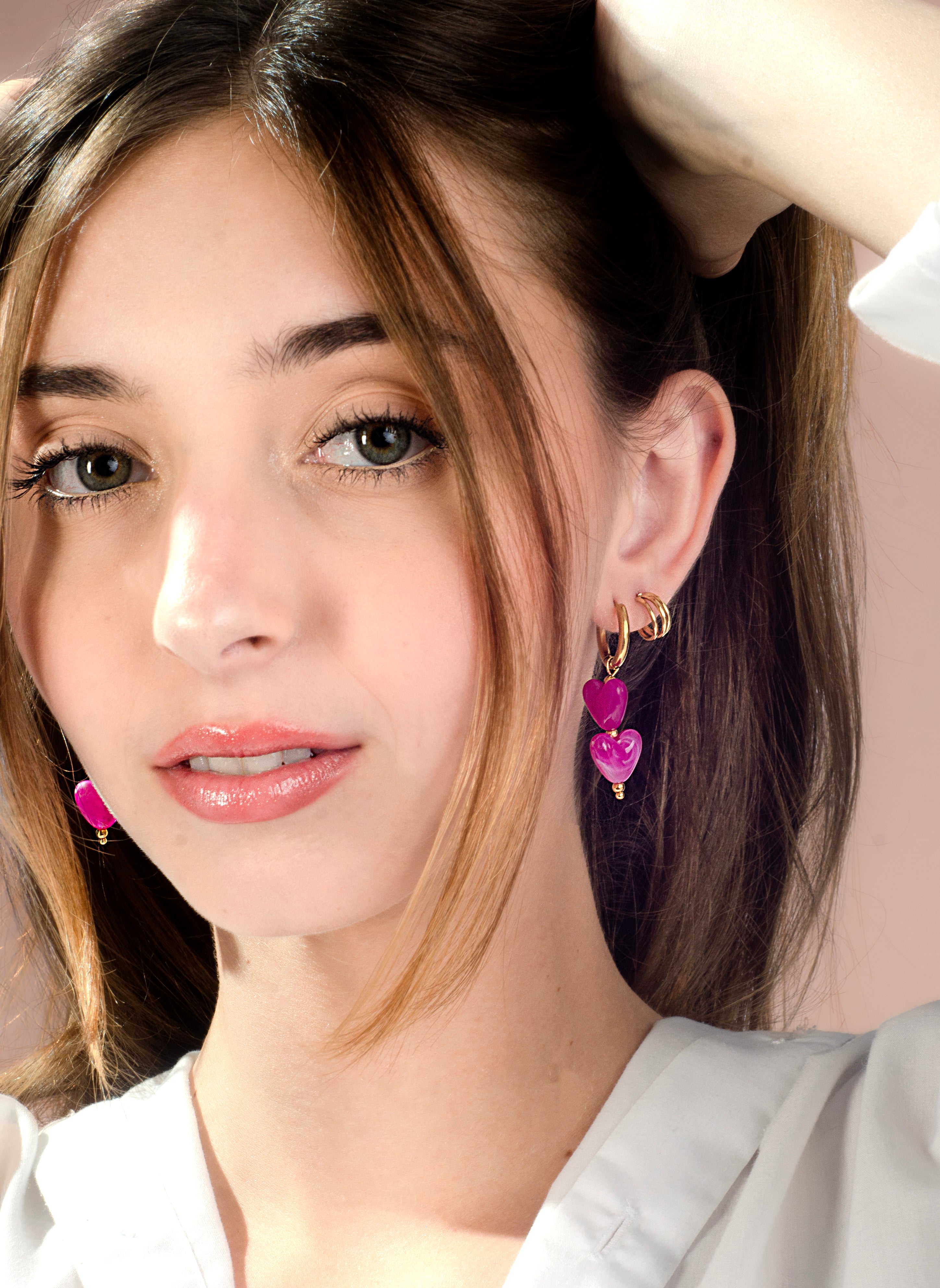 Hartjes kralenoorbellen fuchsia