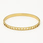 Armband bangle hartjes goudkleurig