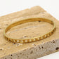 Armband bangle hartjes goudkleurig