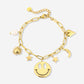 Bedelarmband smiley stars goudkleurig