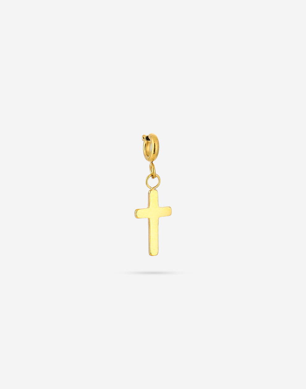 Loose gold-colored cross charm