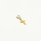 Loose gold-colored cross charm