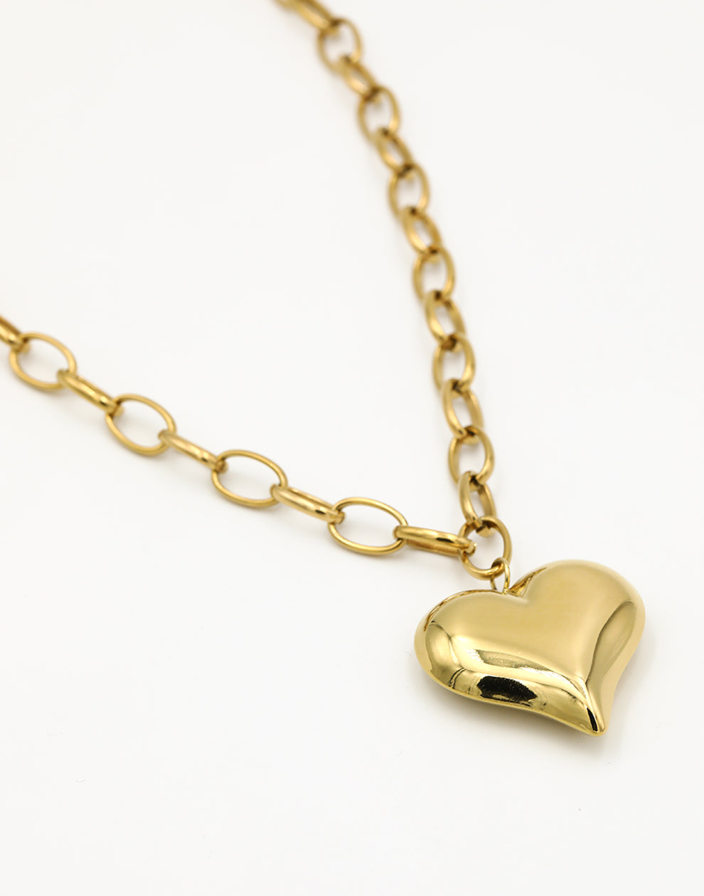 Lange schakelketting met chunky hart goudkleurig
