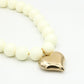 Kralenketting pastel met hart beige