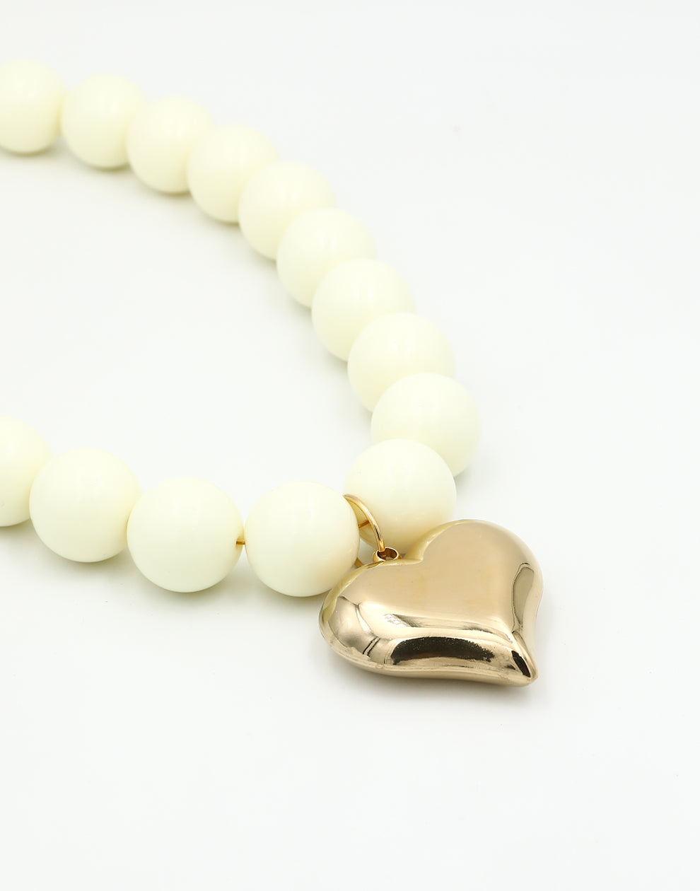 Kralenketting pastel met hart beige