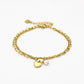 Armband dubbel hartje en parel goudkleurig