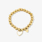 Stretch armband gouden bolletjes met hartjes goudkleurig