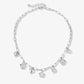 Schakelketting met bedels bloemen en harten zilverkleurig