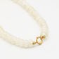 Kralenketting ovaal met slotje beige