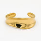 Bangle asymmetrisch gebogen goudkleurig