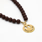 Kralenketting met smiley bruin