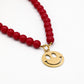 Kralenketting met smiley rood