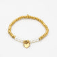 Kralenarmband met parels en hartjes hanger