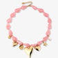 Asymmetrische kralenketting met bedels roze