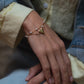 Armband mit Herzen und Perlen, goldfarben