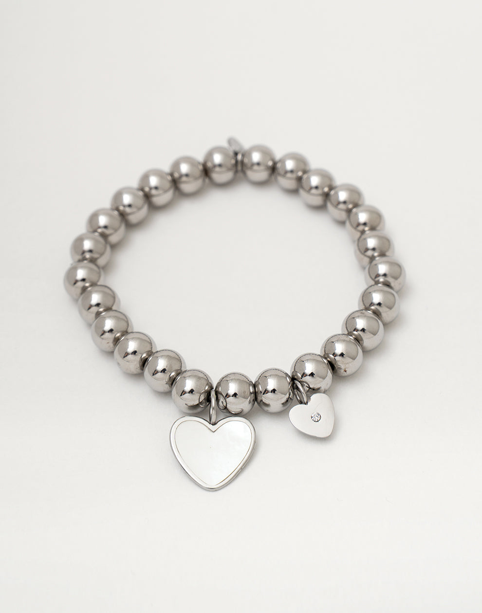 Stretch armband gouden bolletjes met hartjes zilverkleurig